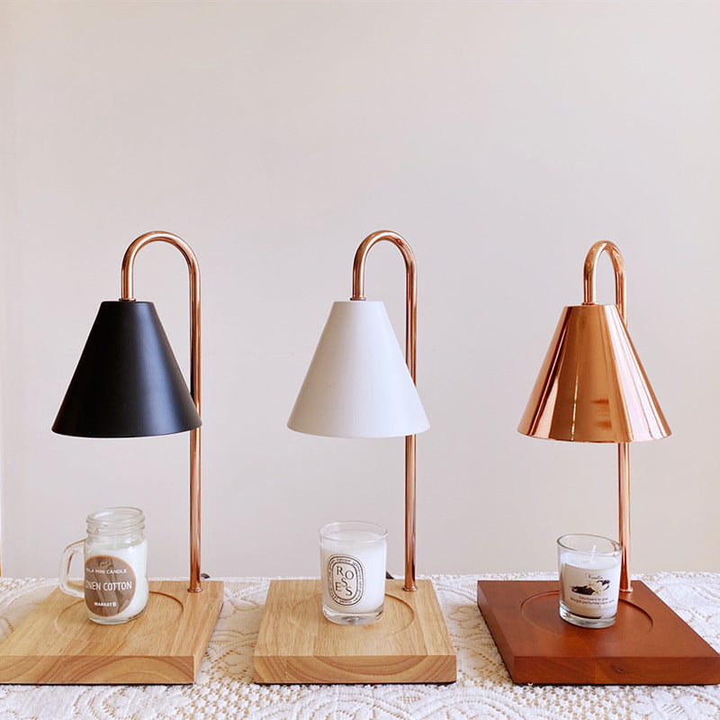 Electric aromatherapy wax melt warmer and diffuser on white background.