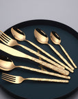 Stainless steel knife and fork set for dining.