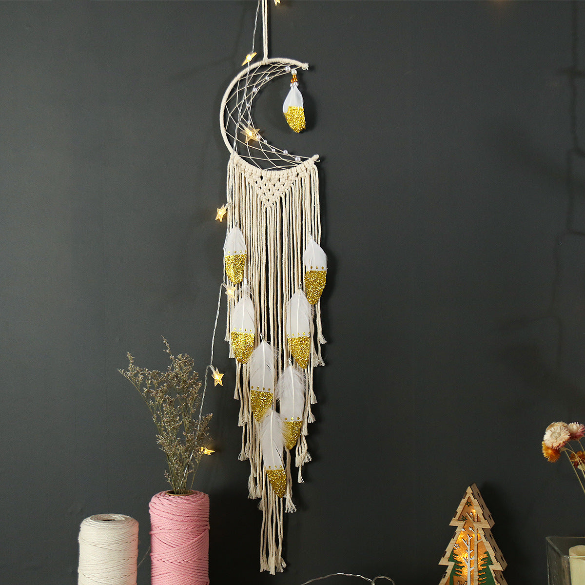 Crescent moon dream catcher for wall hanging on white background.